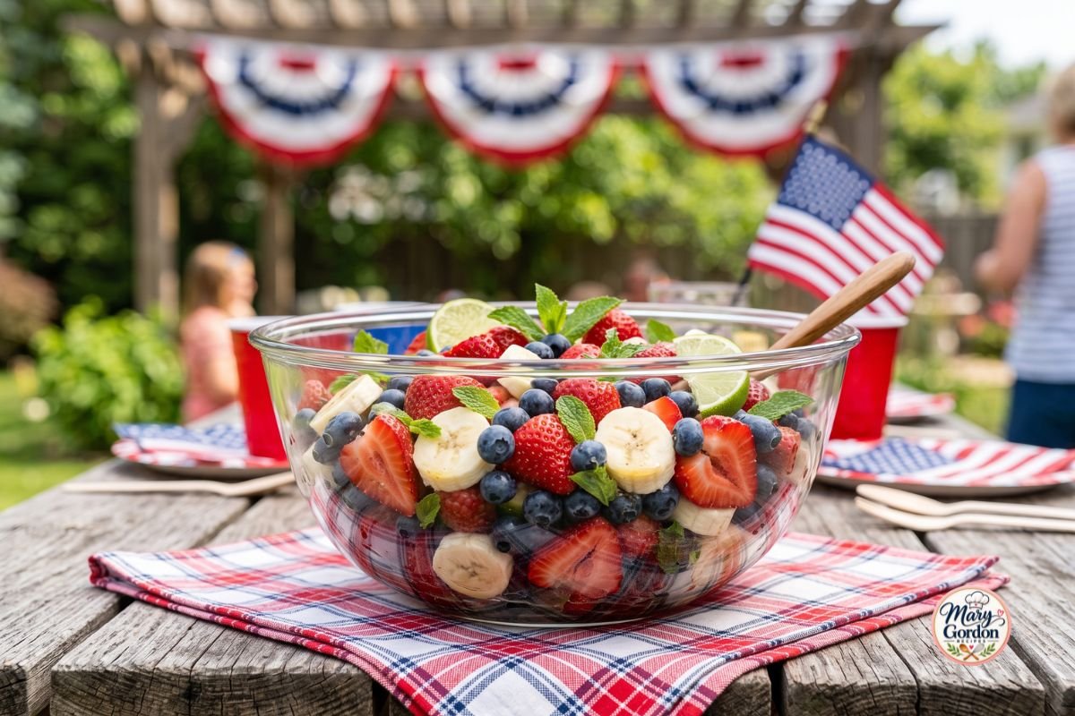 Easy red white and blue fruit salad with strawberries, blueberries, bananas, and honey lime dressing