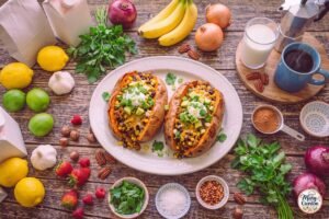 Easy turkey stuffed sweet potatoes topped with cheddar, avocado, cilantro, and green onions