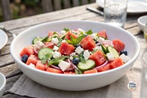 Fresh watermelon feta salad with cucumber, mint, red onion, and lime dressing
