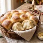 Soft homemade Thanksgiving dinner rolls with golden tops and melted butter
